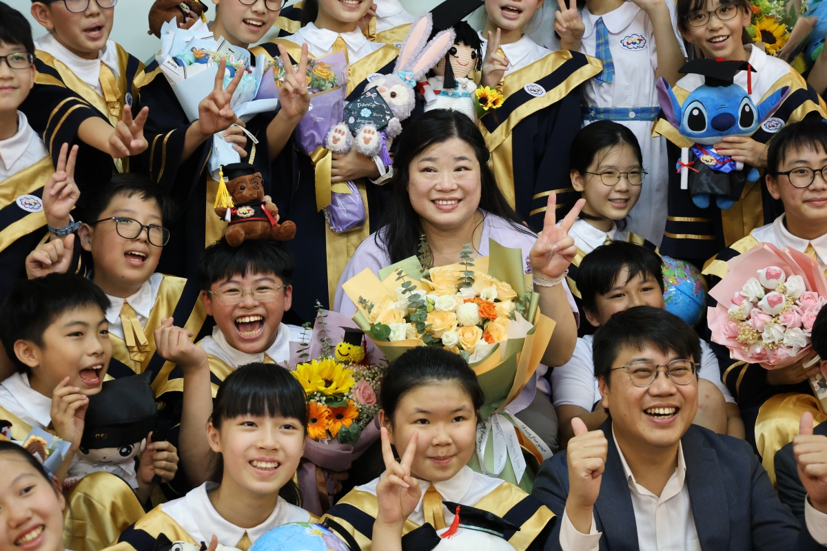 A group of people in graduation gownsDescription automatically generated